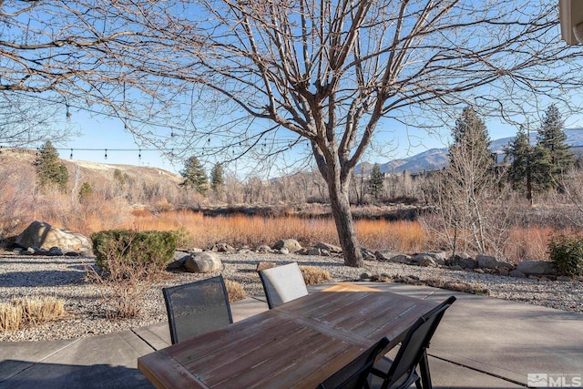 view of patio / terrace with a mountain view