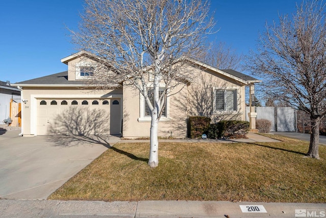 view of front of property with a front yard and a garage