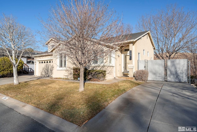 view of front of home with a garage and a front lawn