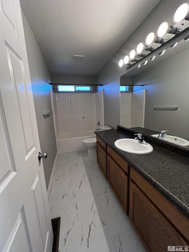 full bathroom featuring a textured ceiling, toilet, shower / bathtub combination, and vanity