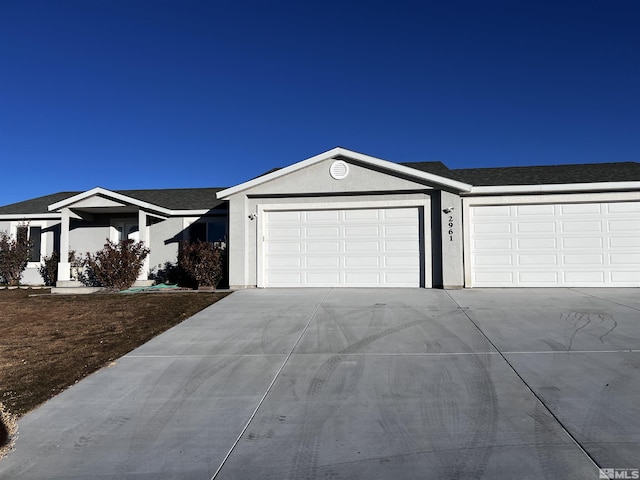 ranch-style home featuring a garage