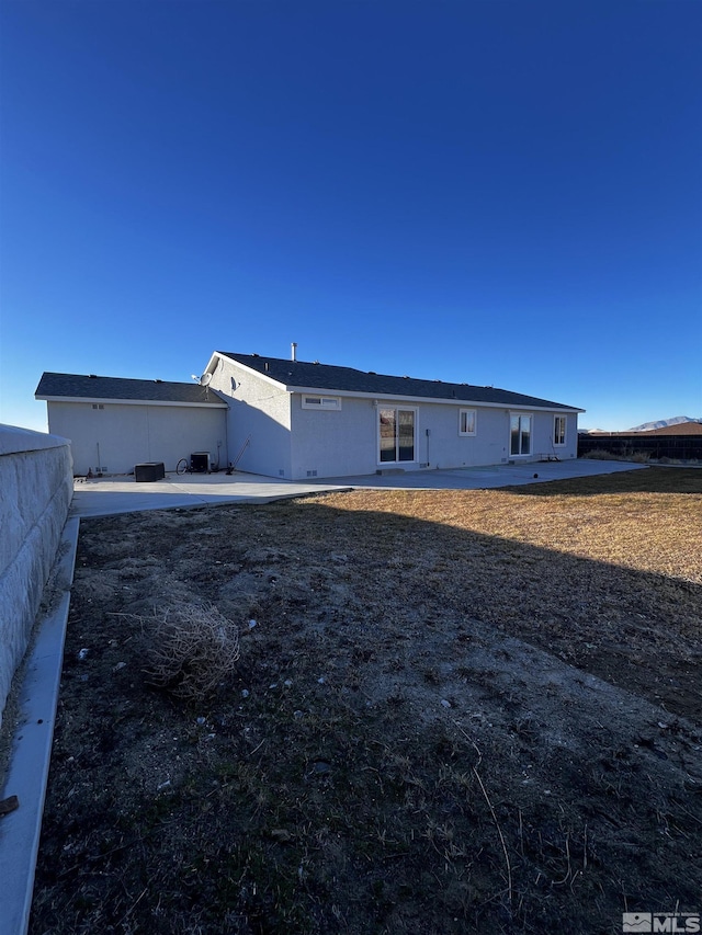 back of property featuring a patio area