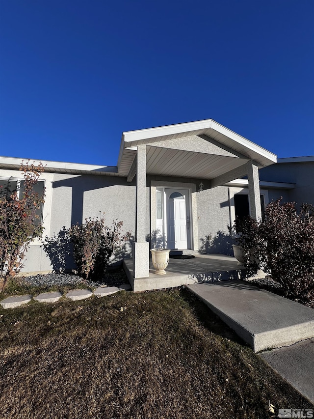 property entrance with a porch