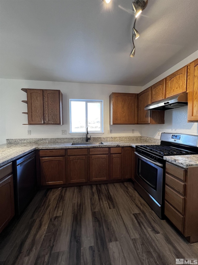 kitchen with light stone countertops, black dishwasher, dark hardwood / wood-style flooring, stainless steel gas stove, and sink