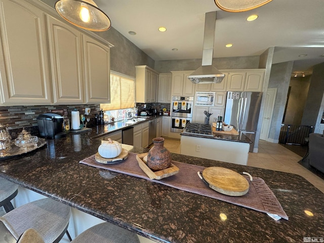 kitchen with backsplash, pendant lighting, sink, stainless steel appliances, and light tile patterned floors