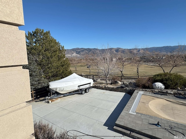 view of patio / terrace featuring a mountain view