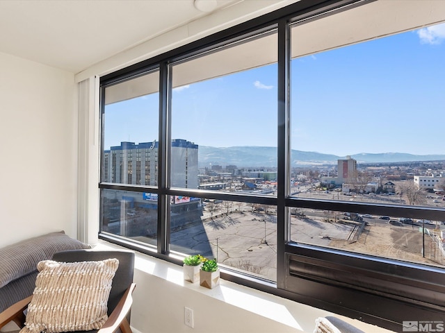 interior space with a healthy amount of sunlight and a mountain view