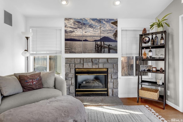 living room featuring a fireplace and hardwood / wood-style floors