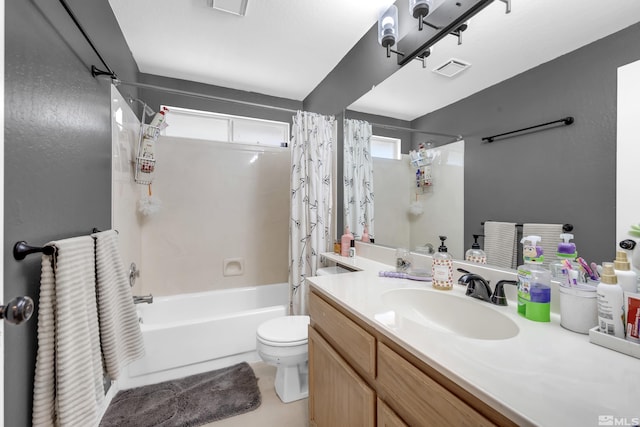 full bathroom featuring toilet, vanity, and shower / bath combination with curtain