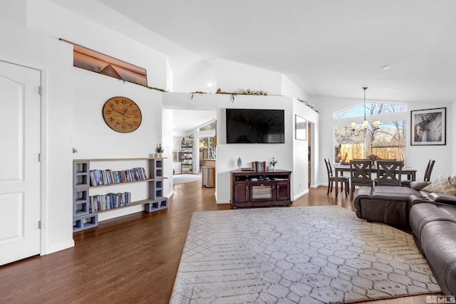 living room with vaulted ceiling, dark wood-type flooring, and a chandelier