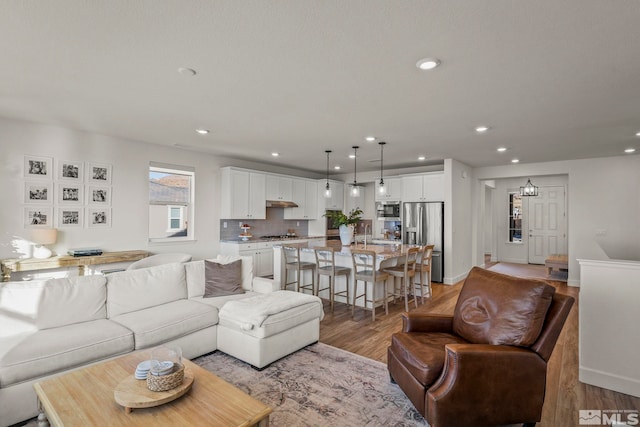 living room with light hardwood / wood-style flooring