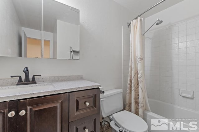 full bathroom featuring toilet, vanity, and shower / bath combo