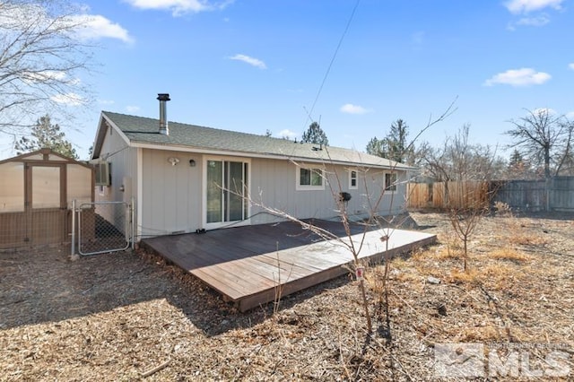 back of property featuring a deck