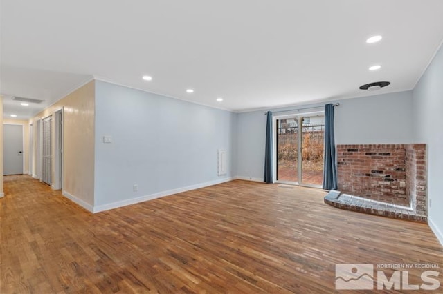 unfurnished room with crown molding and light hardwood / wood-style flooring