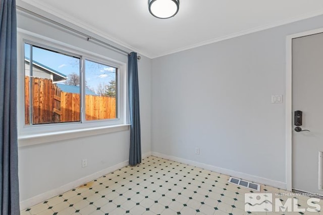 empty room featuring ornamental molding