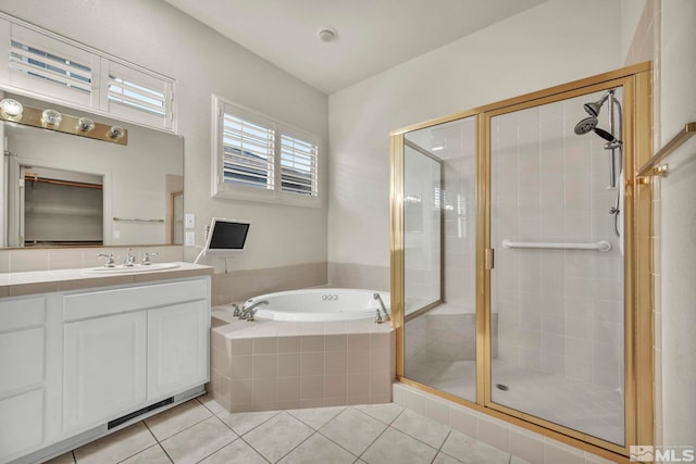 bathroom with vanity, tile patterned floors, and shower with separate bathtub