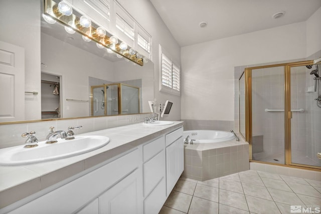 bathroom with tile patterned floors, vanity, and independent shower and bath