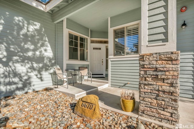 entrance to property with covered porch