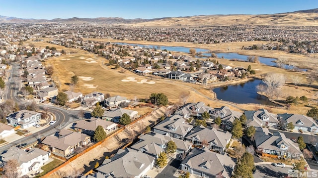 aerial view featuring a water and mountain view