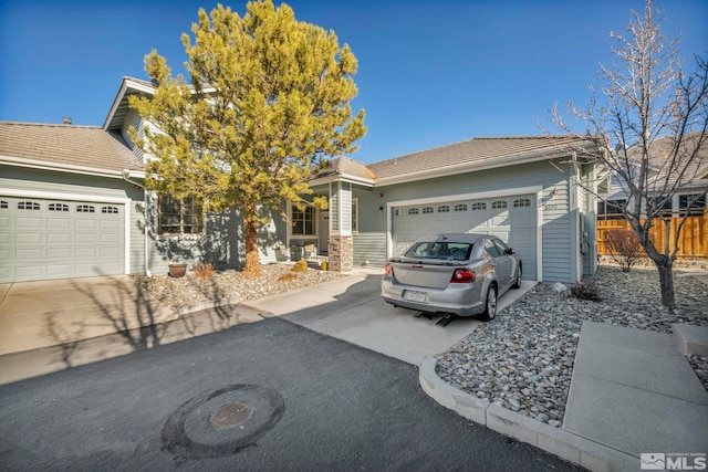 ranch-style house featuring a garage