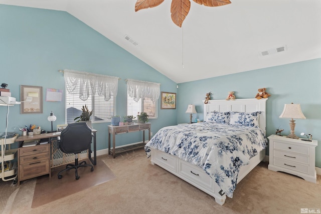 bedroom with lofted ceiling and light carpet