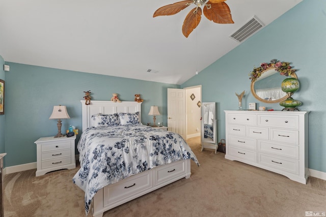 bedroom with ceiling fan, light colored carpet, and vaulted ceiling