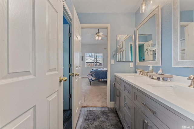 bathroom featuring ceiling fan and vanity