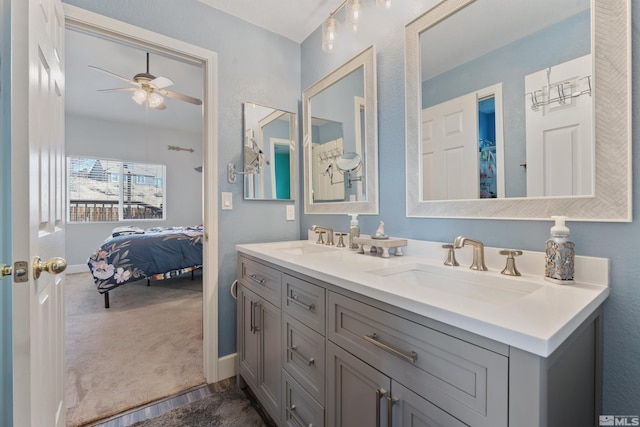 bathroom featuring ceiling fan and vanity