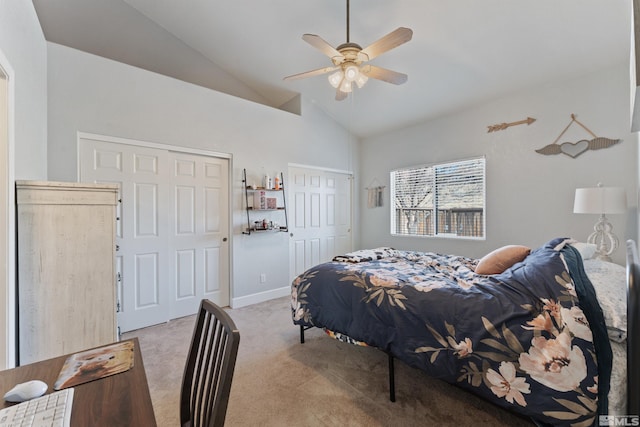 carpeted bedroom with ceiling fan and vaulted ceiling