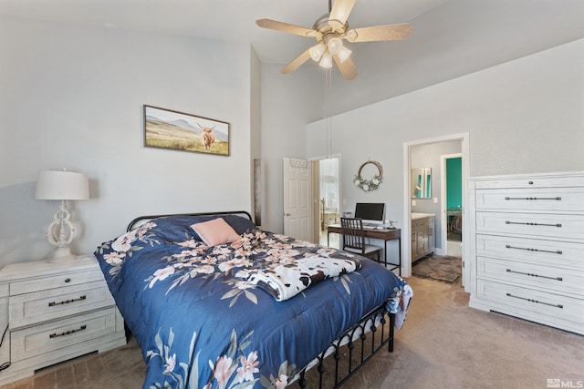 carpeted bedroom with ceiling fan and connected bathroom