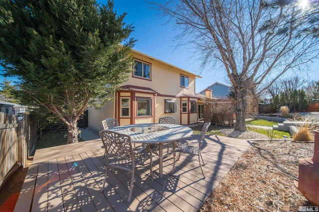 back of house with a wooden deck