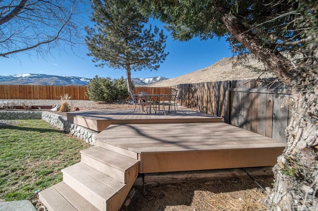 wooden deck with a mountain view