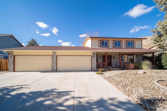 front of property featuring a garage and a porch