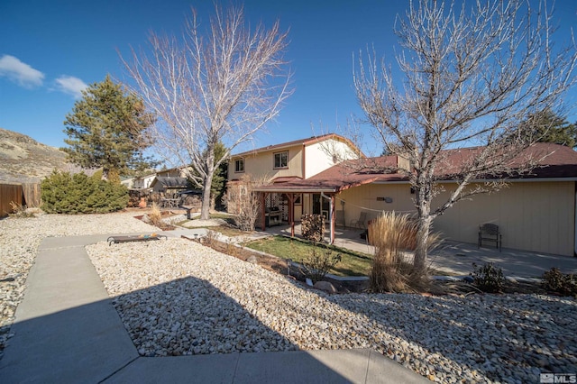 back of house with a patio area