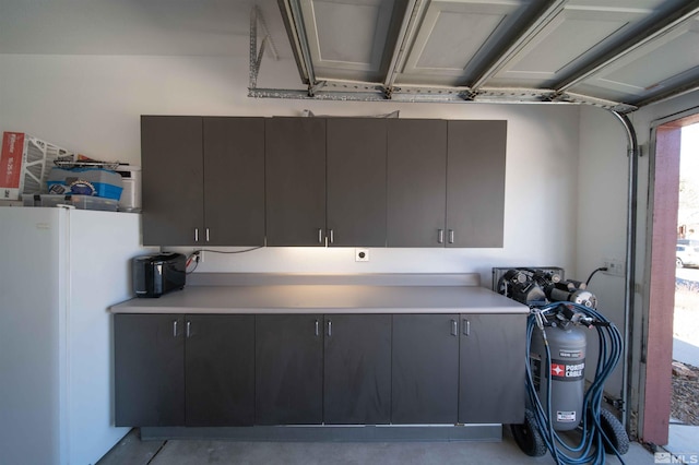 garage with white refrigerator