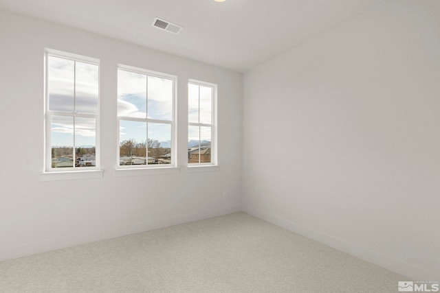 unfurnished room with carpet flooring