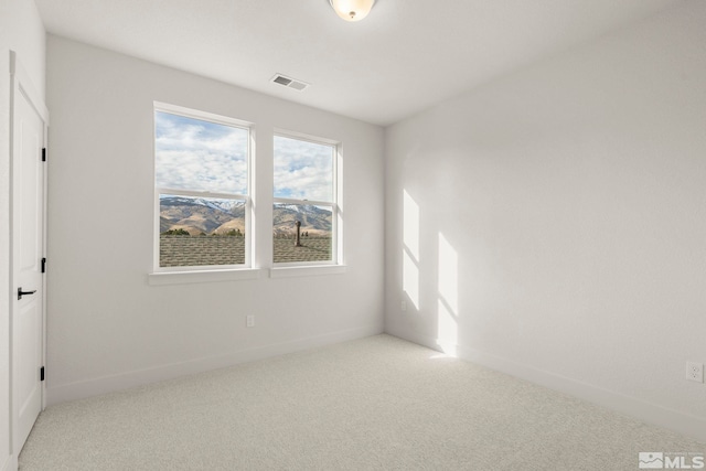 unfurnished room featuring carpet flooring