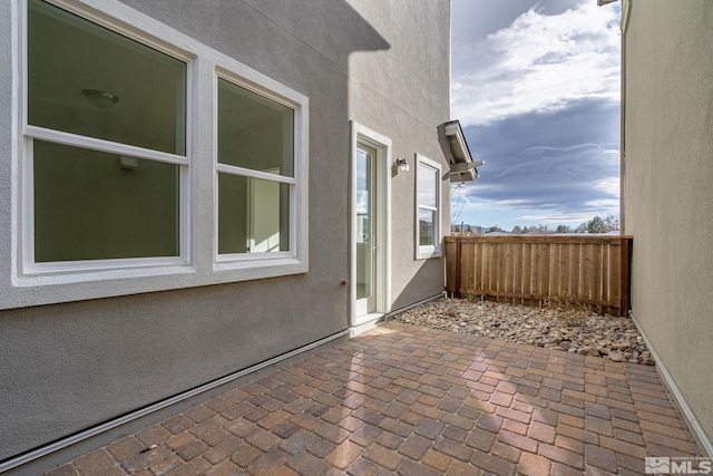 view of side of home featuring a patio