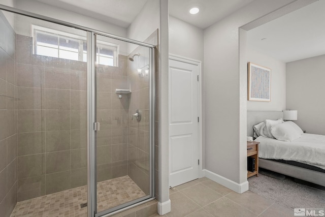 bathroom with tile patterned flooring and an enclosed shower