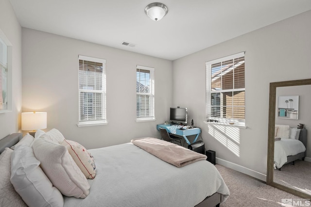 bedroom featuring carpet