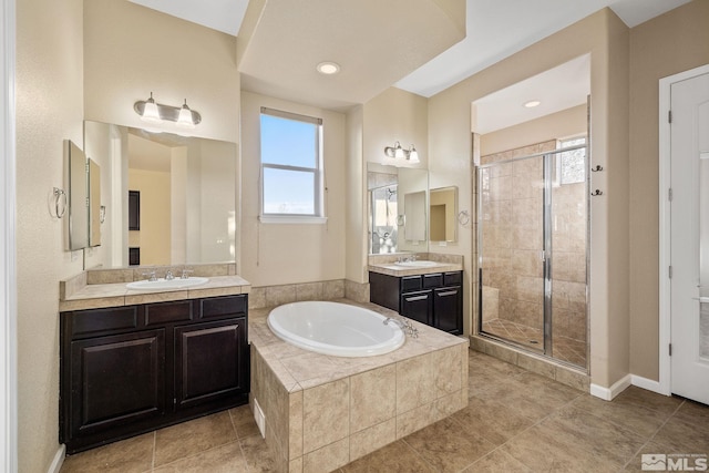 bathroom featuring separate shower and tub and vanity