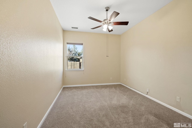 carpeted empty room with ceiling fan