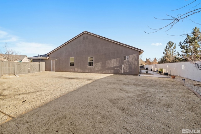 back of property with a patio area