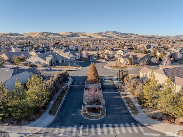 birds eye view of property featuring a mountain view