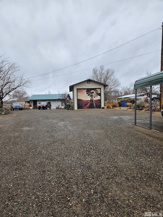 view of yard with an outdoor structure and a garage