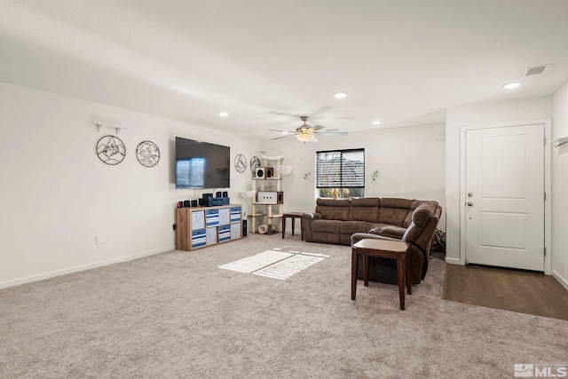 living room with carpet floors and ceiling fan