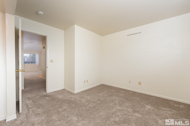 unfurnished room with light carpet