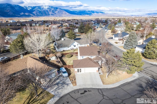 birds eye view of property with a mountain view