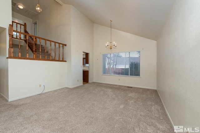 unfurnished living room featuring high vaulted ceiling, carpet, and an inviting chandelier