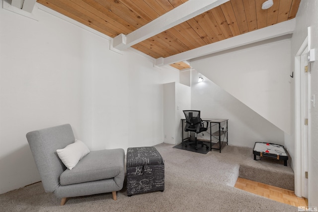 living area featuring beam ceiling, parquet floors, and wooden ceiling